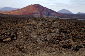 volcanic stone in los volcanes lanzarote  spain  timanfaya  rock  sky  hill and summer 

