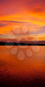  view from water  of the sunrise full of colors and rain concept of relax
