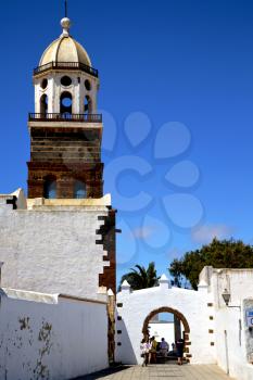 arrecife lanzarote  spain the old wall terrace church bell tower plant in teguise
