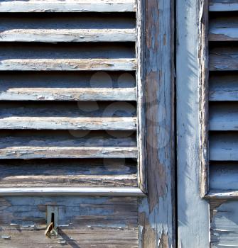 grey window   castellanza   palaces italy   abstract  sunny day    wood venetian blind in the concrete  brick  
