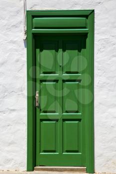 spain  piece of colorated green wood as a window door in lanzarote 
 