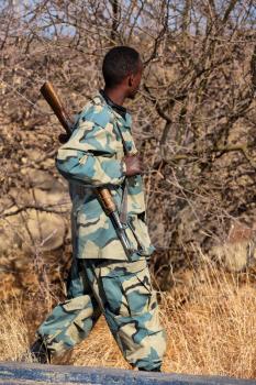  africa  in the land of ethiopia a black soldier  and his gun looking the boarder