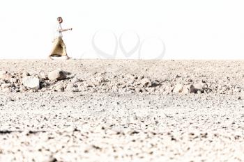 ETHIOPIA,DANAKIL-CIRCA  JANUARY 2018--unidentified  man walking in the rock desert