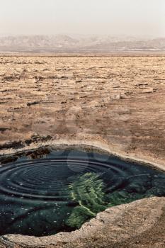 in  danakil ethiopia africa    the black lake with boiling oil and hot
