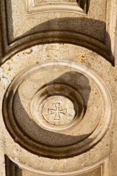 lonate pozzolo lombardy italy  varese abstract   wall of a curch circle  pattern  cross