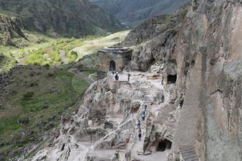 GEORGIA, VARDZIA-CIRCA MAY 2019--unidentified people near the antique cave and excavated city
