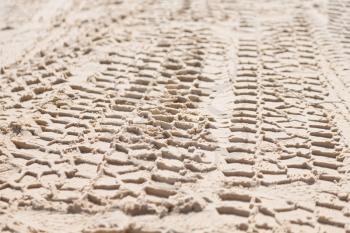 in the desert  beach track of car and truck in the sand like abstract background