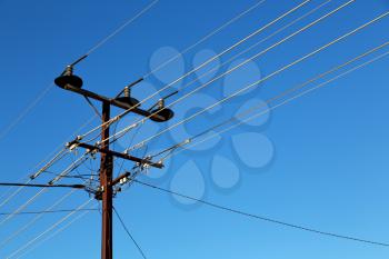 in  australia the concept of power line with electrical pole in the clear sky