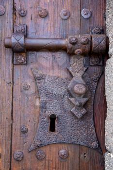 castle lock spain knocker lanzarote abstract door wood in the red brown 
