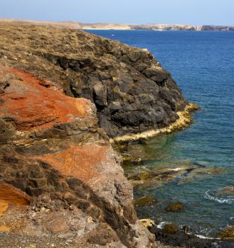 musk pond rock stone sky  water  coastline and summer in el golfo lanzarote spain
