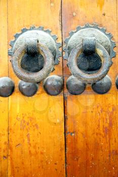 brown    morocco in    africa the old wood  facade home and rusty safe padlock 