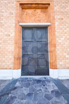 vergiate italy   church  varese  the old door entrance and mosaic sunny daY rose window