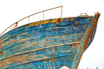   boat and sea       in africa morocco old    castle brown brick  sky pier
