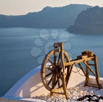 greece in santorini the old town near      mediterranean sea and  spinning wheel