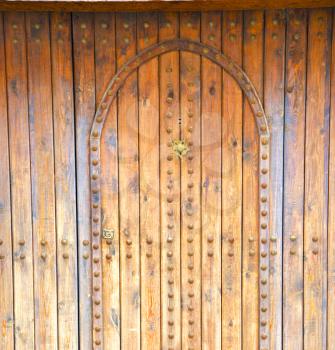 
historical in  antique building door morocco style africa   wood and metal rusty
