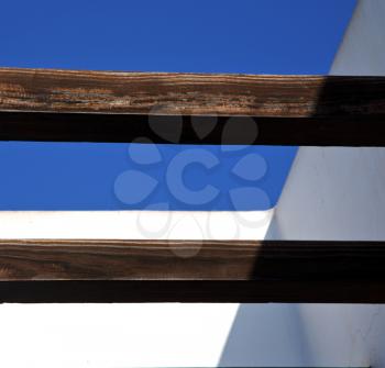 piece of brown   wood as a roof in the sky  lanzarote spain