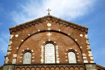  italy  lombardy     in  the   legnano  old   church   closed brick tower   wall rose   window tile   