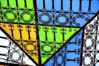colorated glass and sun in morocco africa window and light
