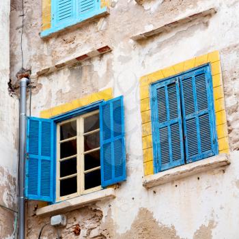 blue window in morocco africa old construction and brown wall  construction