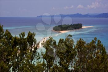 isthmus isle boat palm  rock stone branch hill lagoon and coastline in madagascar nosy be
