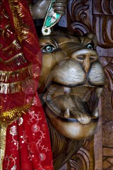 head of lion precious stone marble  wood statue of a Hinduism  women  Shiva vishnu Brahma in a temple near a lake in mauritius africa
