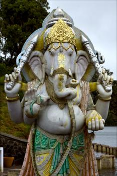 grey marble statue of a Hinduism  elephant  Shiva vishnu Brahma in a temple near a lake in mauritius africa
