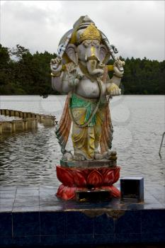 grey marble statue of a Hinduism  elephant  Shiva vishnu Brahma in a temple near a lake in mauritius africa

