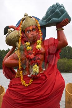 marble wood statue of a Hinduism  monkey  Shiva vishnu Brahma in a temple near a lake in mauritius africa

