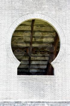 old window and wall in plaza de toros centre of colonia del sacramento uruguay