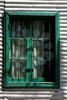 green wood venetian blind and a metal wall in la boca buenos aires argentina