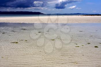 mountain beach sky sand isle and rock in indian ocean madagascar