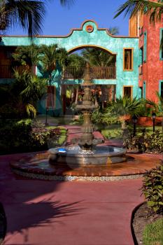 mexico bush  fountain and red house  in playa del carmen