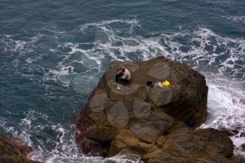 fisherman abstract rock water   and coastline in via dell amore riomaggiore manarola italy
