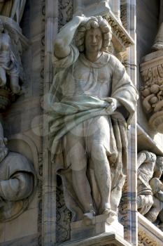 italy statue of a women in the front of the duomo  church in milan and incision
