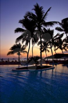 swimming pool sunset parasol  lagoon and coastline in madagascar nosy be