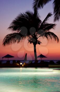 swimming pool sunset parasol  lagoon and coastline in madagascar nosy be