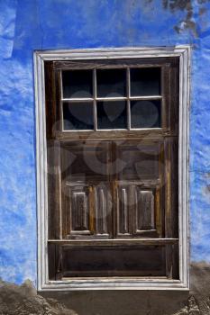 blue wood  distorted window in a paint wall arrecife lanzarote spain