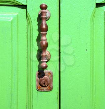 spain   brass knocker lanzarote abstract door wood in the green 