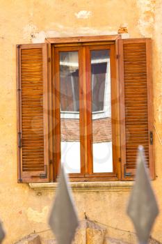 shutter europe  italy  lombardy        in  the milano old   window closed brick      abstract grate red