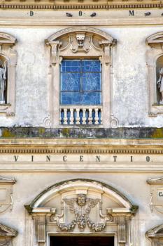 caronno varesino cross church varese italy the old rose window   and mosaic wall