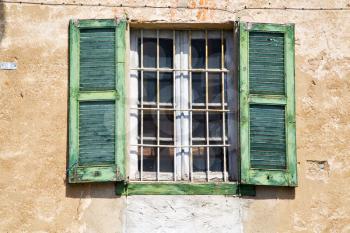 lonate ceppino varese italy abstract  window   green  wood venetian blind in the concrete