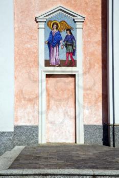 church  mornago varese italy the old door entrance and mosaic