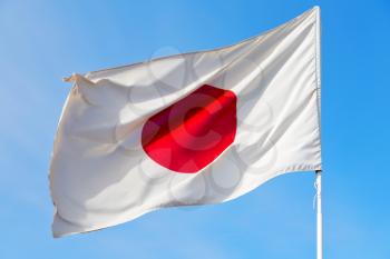 waving flag in the blue sky japancolour and wave