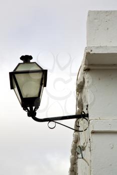 spain street lamp a bulb in the cloudy sky wall arrecife teguise lanzarote 
