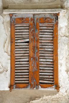 cavaria varese italy abstract  window      wood venetian blind in the concrete orange