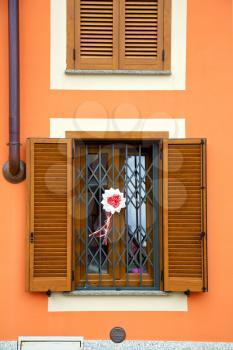   cavaria varese italy abstract  window      wood venetian blind in the concrete orange