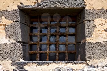 brown distorted  castle window in a broke   wall arrecife lanzarote spain
