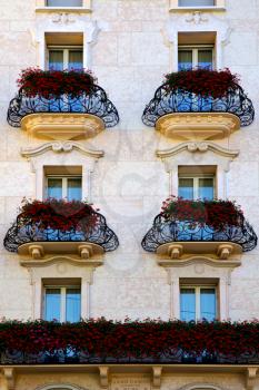 Swiss old wall and flower terrace in the   centre   of city lugano Switzerland
