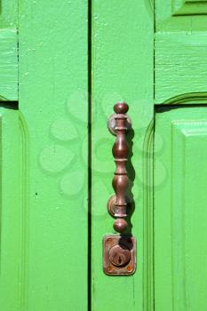 spain   brass knocker lanzarote abstract door wood in the green 