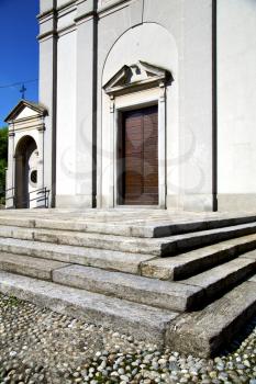 italy  sumirago church  varese  the old door entrance and mosaic sunny daY 